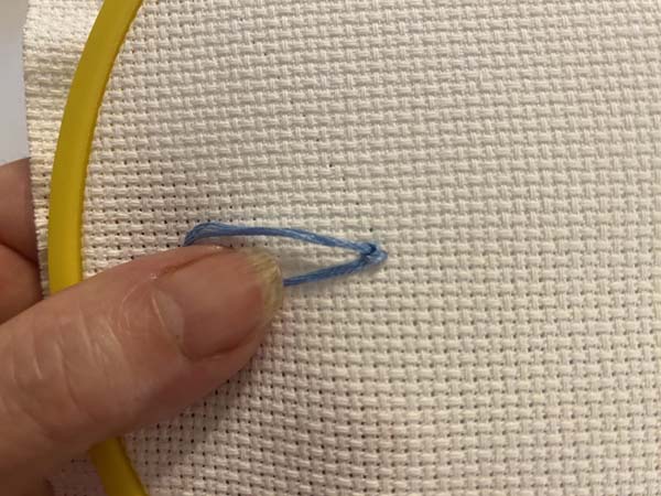French Knot 5 Hold thread while pulling